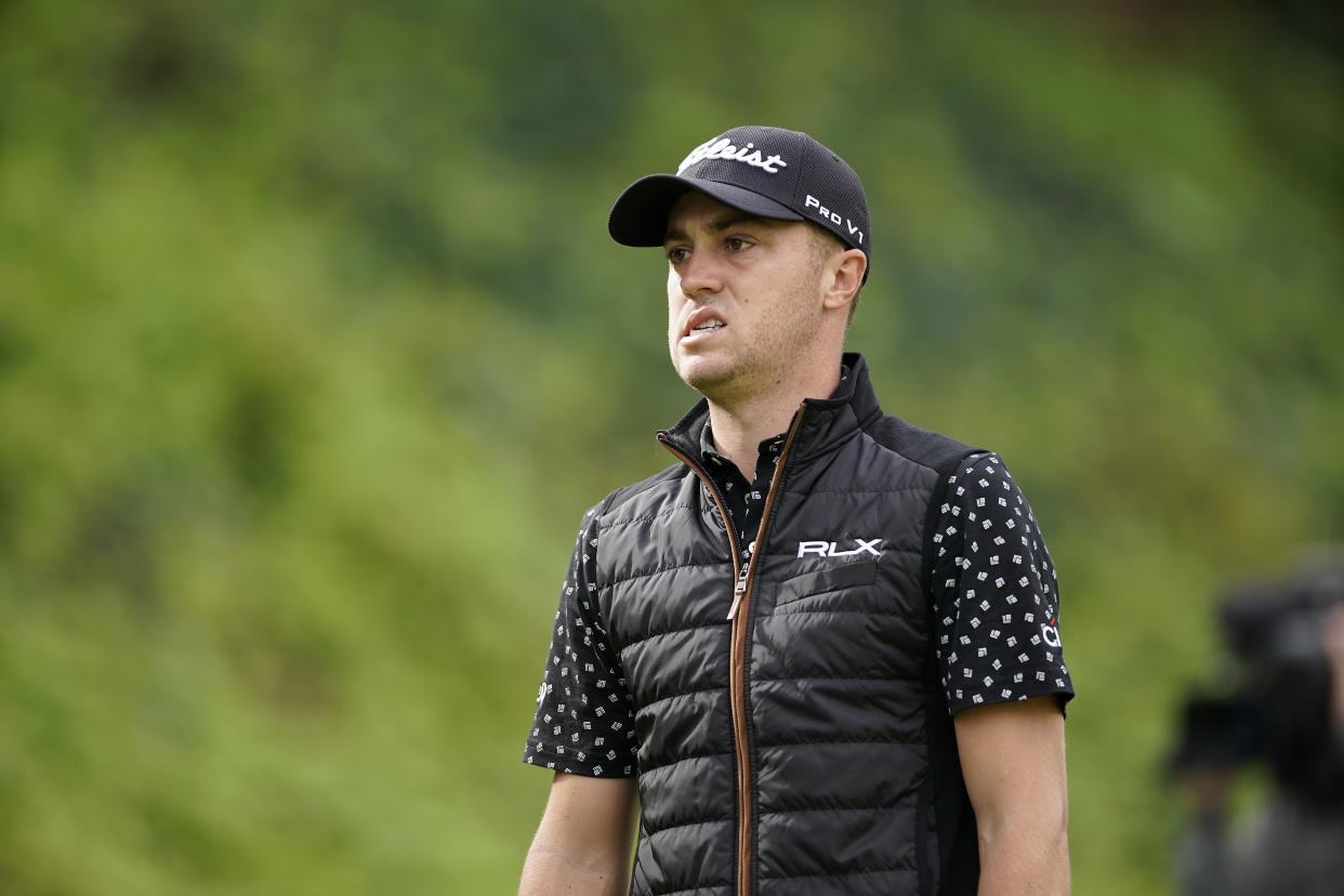 Justin Thomas grimaces after hitting his tee shot into the rough on the seventh hole as first round play continues during the Genesis Open golf tournament at Riviera Country Club on Friday, Feb. 15, 2019, in the Pacific Palisades area of Los Angeles. (AP Photo/Ryan Kang)
