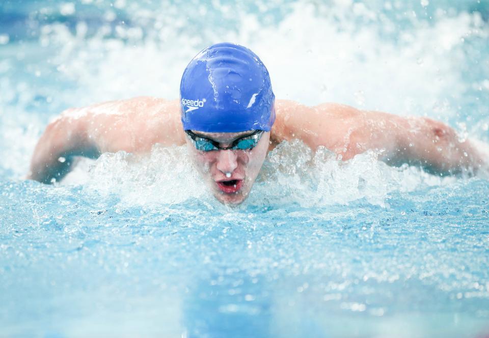 Woodburn’s Mark Seledkov competes in the 100 yard butterfly in the 5A state championships on Saturday, Feb. 18, 2023 at Tualatin Hills Aquatic Center in Beaverton, Ore. Seledkov placed fourth in the event. 