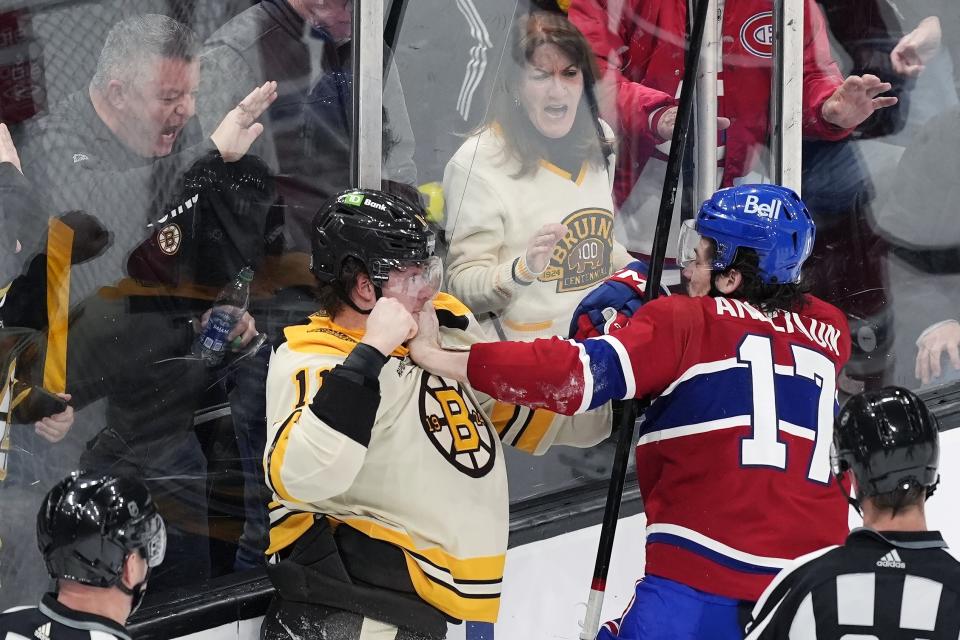 Boston Bruins' Trent Frederic (11) and Montreal Canadiens' Josh Anderson (17) fight during the second period of an NHL hockey game Saturday, Jan 20, 2024, in Boston. (AP Photo/Michael Dwyer)