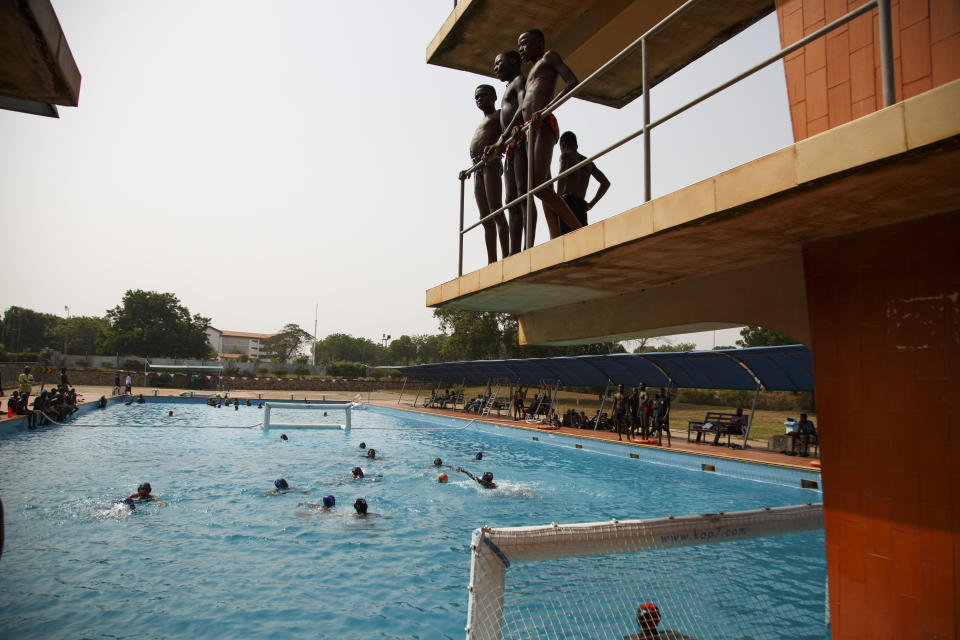 Two teams play water polo during an Awatu Winton Water Polo Club competition at the University of Ghana in Accra, Ghana, Saturday, Jan. 14, 2023. Former water polo pro Asante Prince is training young players in the sport in his father's homeland of Ghana, where swimming pools are rare and the ocean is seen as dangerous. (AP Photo/Misper Apawu)