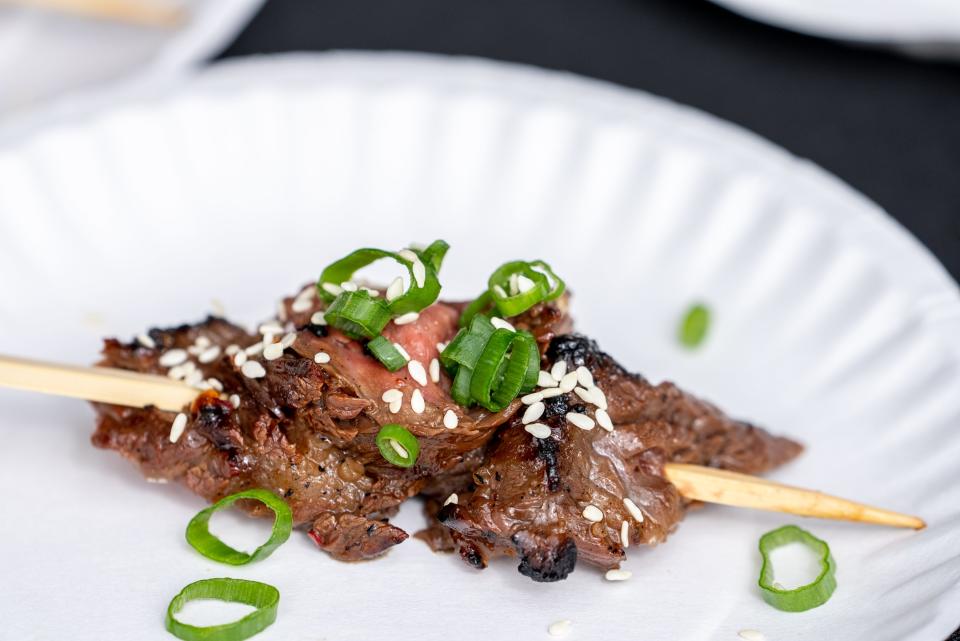 Beef from Belly Kitchen and Bar is displayed for patrons to sample during the 14th annual Devour Culinary Classic at the Desert Botanical Garden in Phoenix on Feb. 25, 2023.