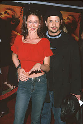 Shannon Elizabeth from American Pie with the dude she's apparently enganged to at the premiere of 20th Century Fox's The Beach