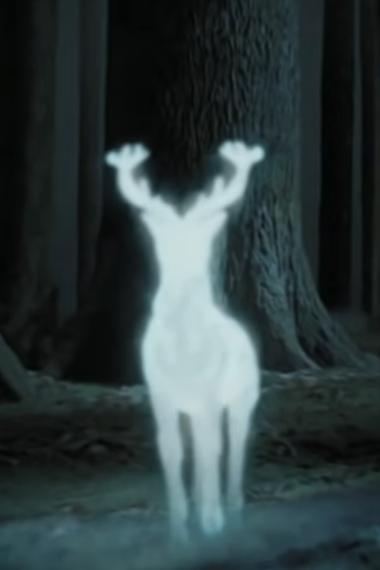 Animated character, Patronus in the form of a stag, from the Harry Potter series, glowing in a dark forest