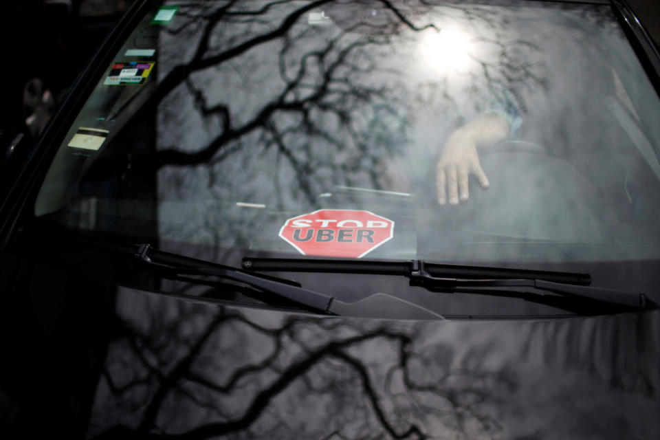 <p>A sign is seen as taxi drivers protest against Uber Technologies Inc. in Lisbon, Portugal, on April 29, 2016. <i>(Rafael Marchante/Reuters)</i></p>