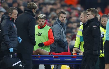 Football Soccer Britain - Liverpool v Sunderland - Premier League - Anfield - 26/11/16 Liverpool's Philippe Coutinho is stretchered off after sustaining an injury as manager Juergen Klopp looks on Reuters / Phil Noble Livepic