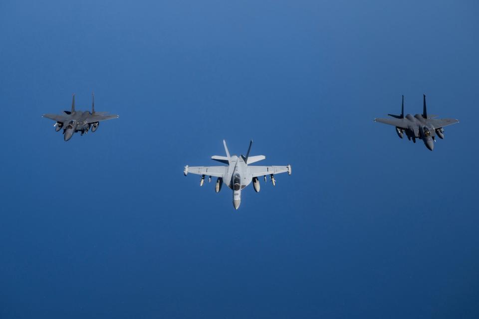 U.S. Air Force F-15E Strike Eagles from Royal Air Force Lakenheath's 494th Fighter Squadron conduct a formation flight with a U.S. Navy E/A-18G Growler, over the U.S. Central Command area of responsibility, May 2, 2024. The U.S. maintains a highly agile fighting force, which leverages the most advanced training and platforms to dominate the warfighting landscape for the long-term security and stability of the region. (U.S. Air Force Photo)