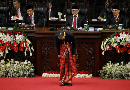 Indonesia president Joko Widodo gestures after delivering a speech in front of parliament members ahead of Thursday's independence day in Jakarta, Indonesia, August 16, 2017. REUTERS/Beawiharta