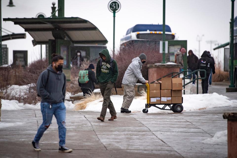 Colorado State University students and staff make their way through campus on Wednesday, Jan. 19, 2022.