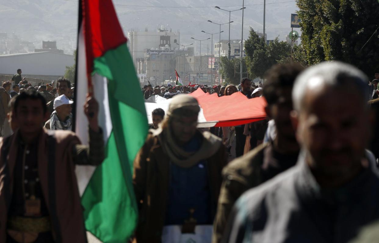 Houthi supporters rally in Yemen following U.S.-U.K. airstrikes. <a href="https://www.gettyimages.com/detail/news-photo/in-this-handout-image-provided-by-the-uk-ministry-of-news-photo/1918198443?adppopup=true" rel="nofollow noopener" target="_blank" data-ylk="slk:Mohammed Hamoud/Getty Images;elm:context_link;itc:0;sec:content-canvas" class="link ">Mohammed Hamoud/Getty Images</a>