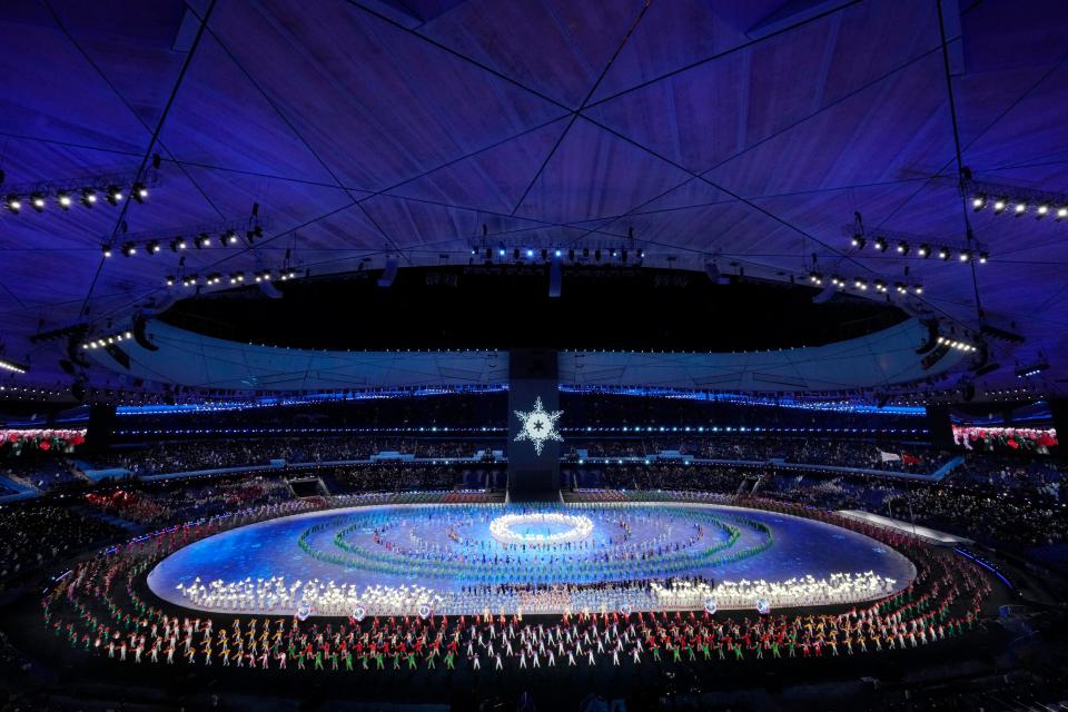 A snowflake is raised after the torch lighting during the Olympics opening ceremony in Beijing on Friday.