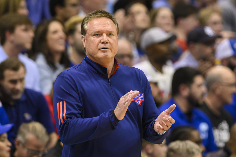 Kansas head coach Bill Self applauds his team's play against Texas Tech during the first half of an NCAA college basketball game in Lawrence, Kan., Tuesday, Feb. 28, 2023. (AP Photo/Reed Hoffmann)