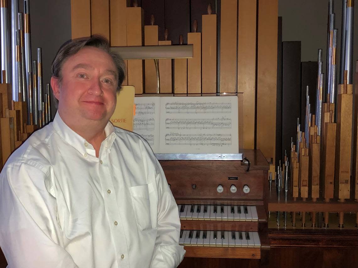 Tom Vozzella leads the choir at St. Andrew’s Episcopal Church.