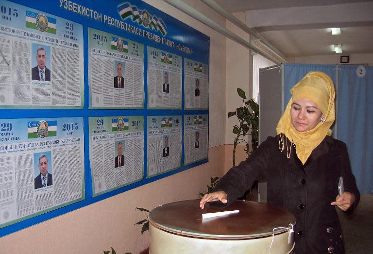 A woman casts her ballot at a polling station in Tashkent, Uzbekistan on March 29, 2015