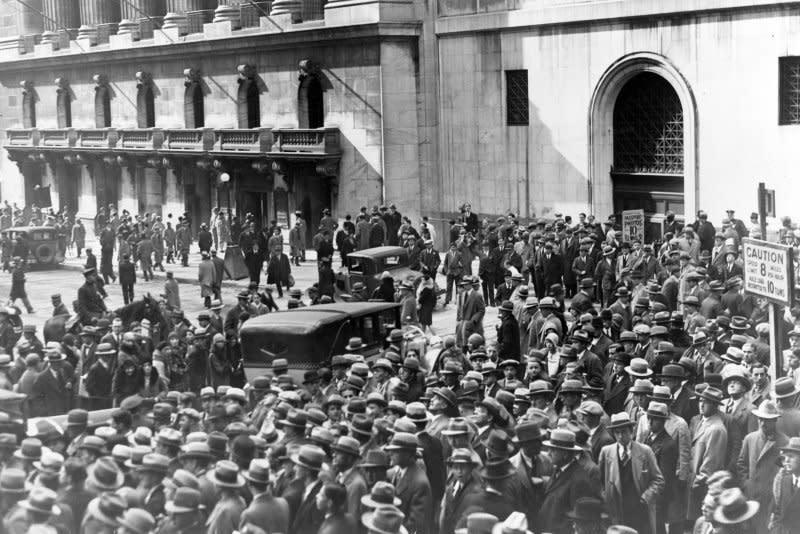 A crowd of people gather outside the New York Stock Exchange following the collapse of the financial markets on October 24, 1929. On October 29, 1929, the sale of 16 million shares marked the collapse of the stock market, setting the stage for the Great Depression. This day became known as "Black Tuesday." File Photo by Library of Congress
