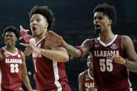 Alabama guard Mark Sears (1) and guard Aaron Estrada (55) react to a possession call during the first half of the NCAA college basketball game against UConn at the Final Four, Saturday, April 6, 2024, in Glendale, Ariz. (AP Photo/Brynn Anderson )