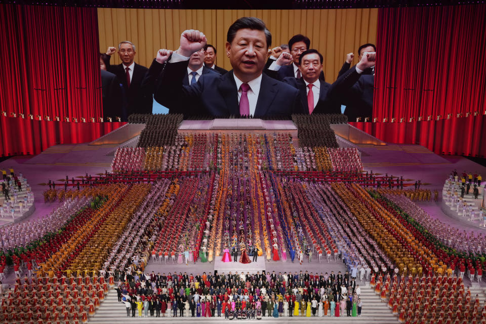 Chinese President Xi Jinping is seen leading other top officials pledging their vows to the party on screen during a gala show ahead of the 100th anniversary of the founding of the Chinese Communist Party in Beijing on Monday, June 28, 2021. For China's Communist Party, celebrating its 100th birthday on Thursday, July 1 is not just about glorifying its past. It's also about cementing its future and that of its leader, Chinese President Xi Jinping. (AP Photo/Ng Han Guan)