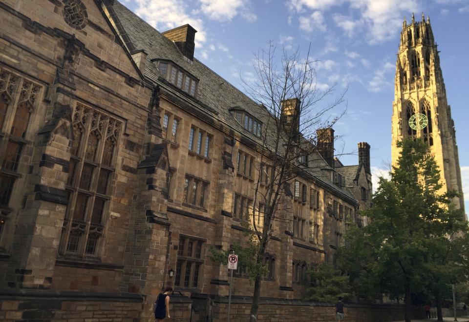 FILE - This Sept. 9, 2016 photo shows Harkness Tower on the campus of Yale University in New Haven, Conn. The U.S. Education Department said Wednesday, Feb. 12, 2020, it is investigating foreign gifts made to Harvard and Yale as part of a broader review of international money flowing to American universities. (AP Photo/Beth J. Harpaz, File)