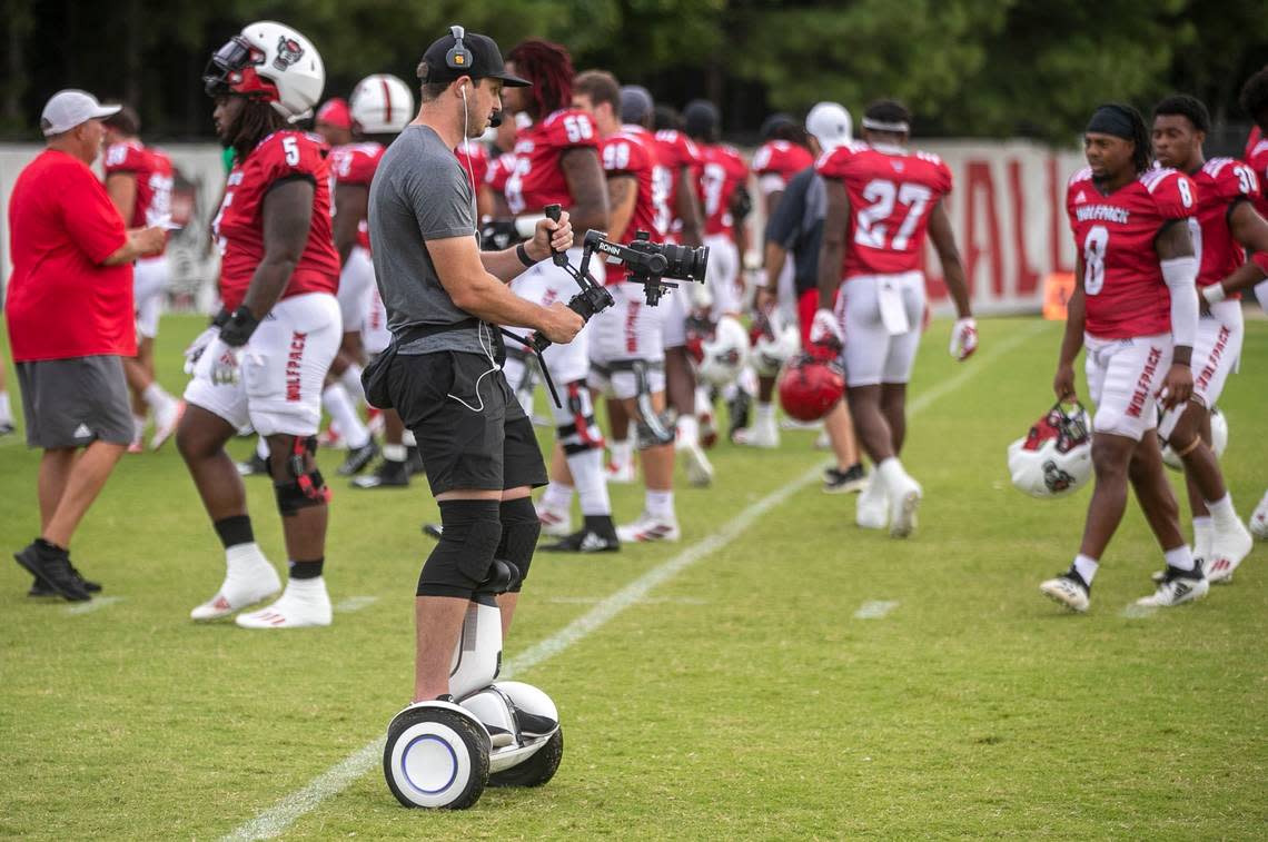 ACC Network videographer Max Brooke records the N.C. State Wolfpacks practice for their all-access package on Thursday, August 11, 2022 in Raleigh, N.C.