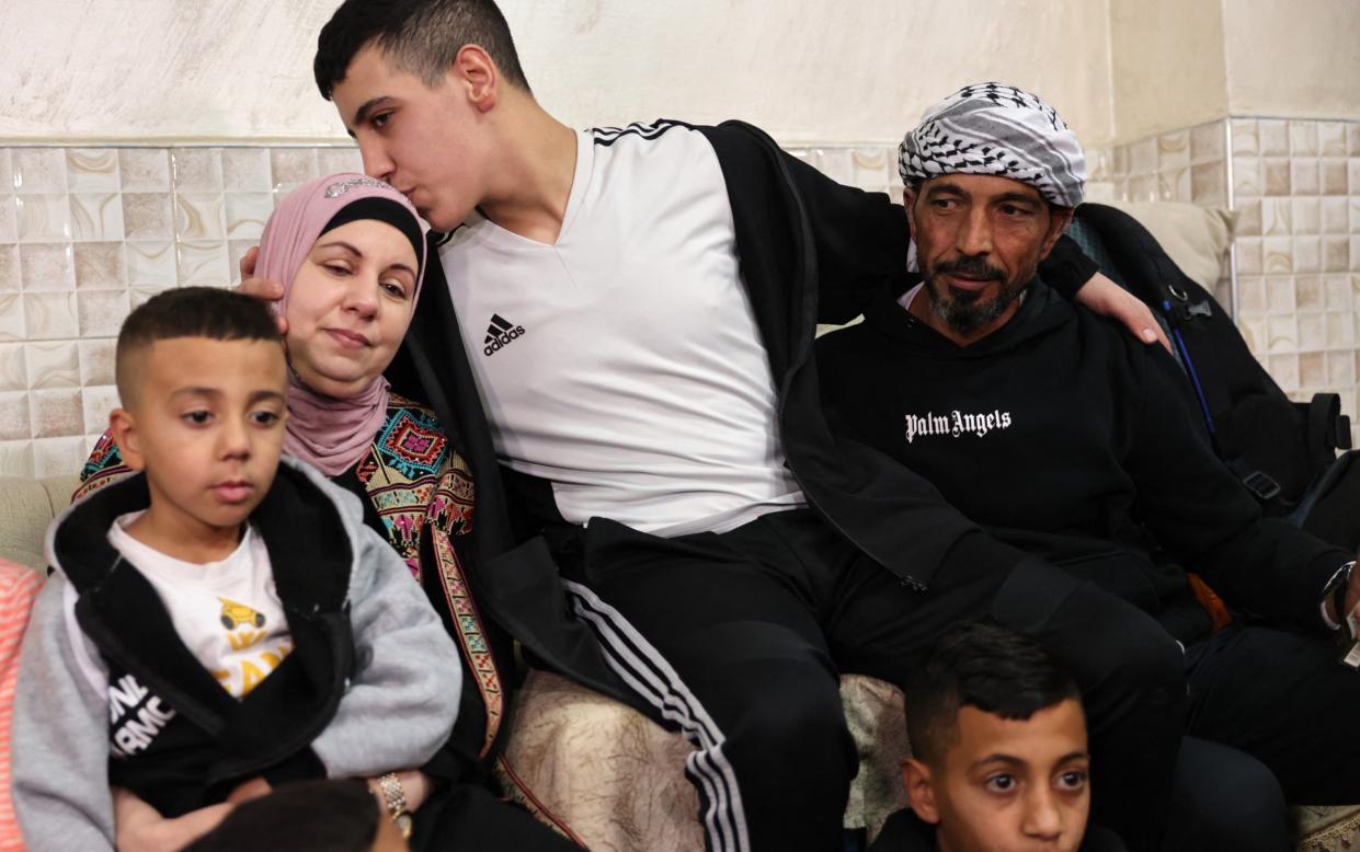 Ahmad Salaima is welcomed by his family upon his arrival at his home in Israeli-annexed east Jerusalem