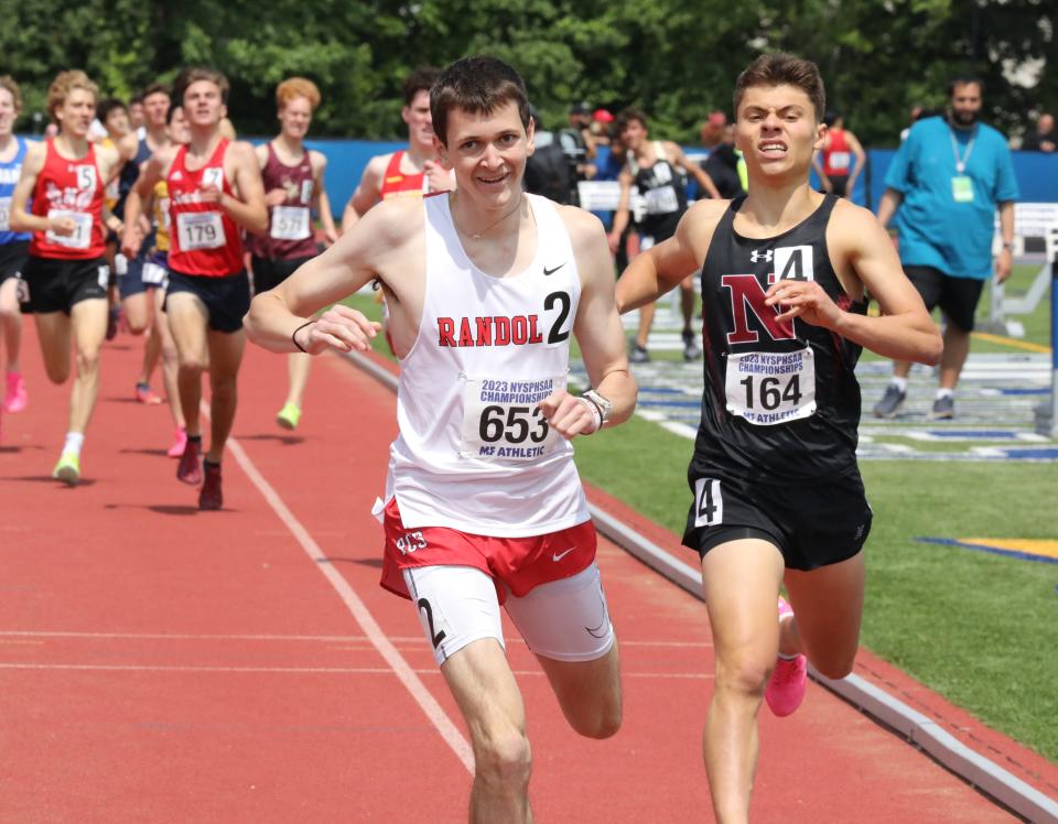 Roan Kelly from Randolph (653) and Nyack's Matthew Schutzbank (164) compete in the boys 1600 meter run championship during the New York State Track and Field Championships at Middletown High School, June 10, 2023.