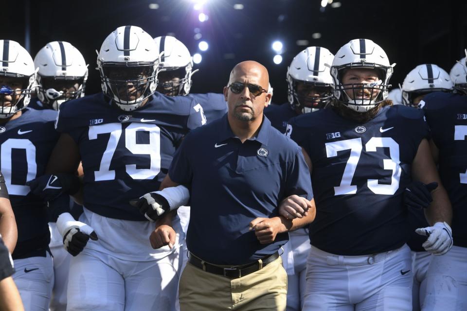 Penn State coach James Franklin walks with his players onto the field before a game against Ball State on Sept. 11.