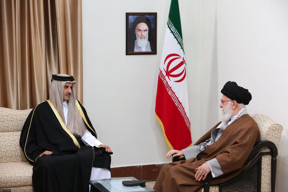 FILE - In this Sunday, Jan. 12, 2020 file photo, released by an official website of the office of the Iranian supreme leader, Supreme Leader Ayatollah Ali Khamenei, right, meets Emir of Qatar Sheikh Tamim bin Hamad Al Thani, in Tehran, Iran. A flurry of diplomatic visits and meetings crisscrossing the Persian Gulf are driving urgent efforts to defuse the possibility of all-out war after the U.S. killed Iran's top military commander. Global leaders and top diplomats are repeating in recent days the mantra of “de-escalation” and “dialogue,” yet none have publicly laid out a path to achieving either. (Office of the Iranian Supreme Leader via AP, File)