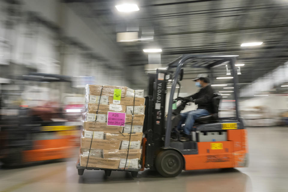 A mail handler unloads pallets filled with Washington and Oregon mail-in ballots at a U.S. Postal Service processing and distribution center on Oct. 14, 2020, in Portland, Oregon. (Photo: Nathan Howard/Getty Images)