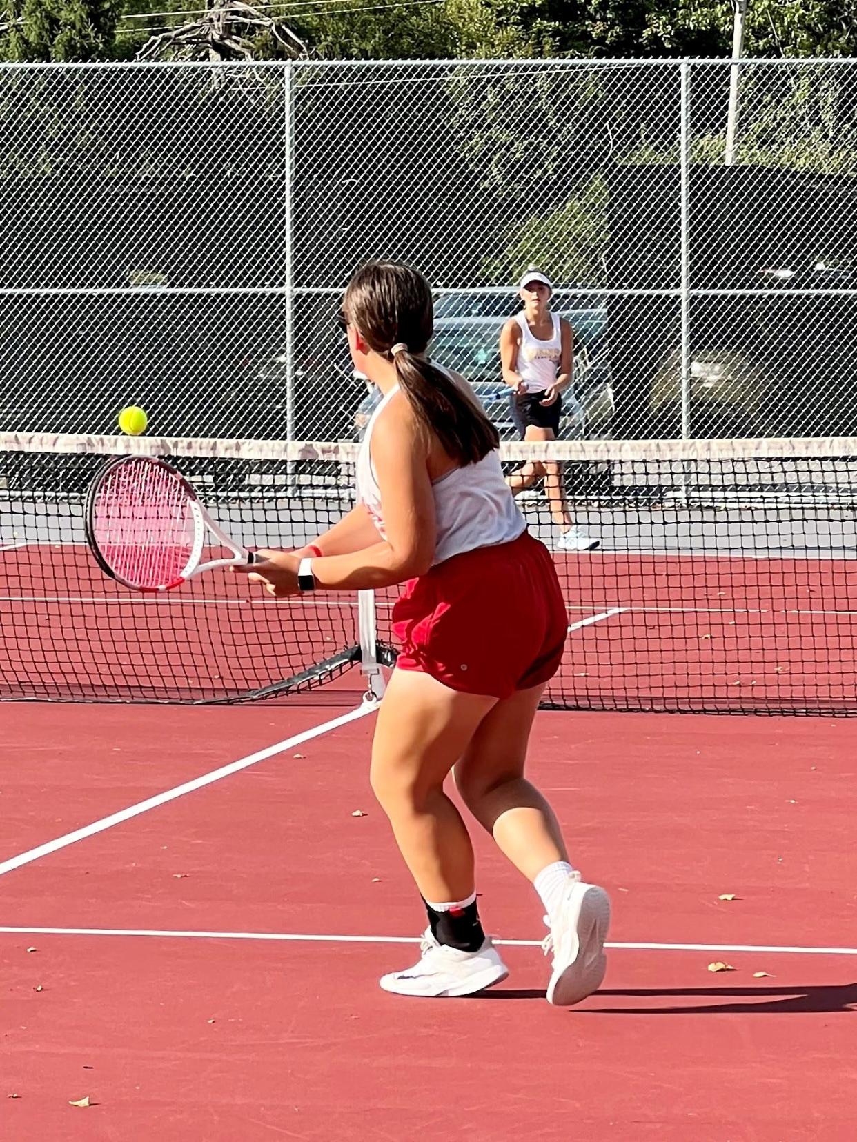 Marion Harding's Audrey Feasel returns a shot to River Valley's Shayla Pappert during a second singles girls tennis match last week at Grant Middle School