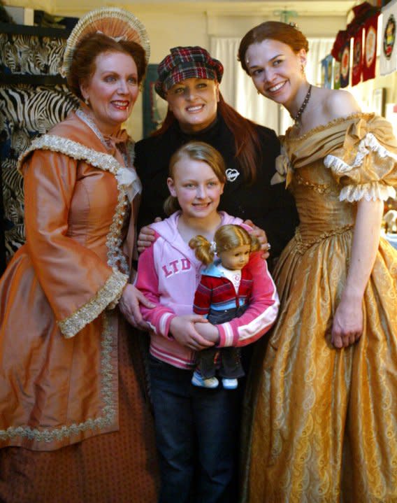 Wynonna Judd, center and her daughter Grace, 8, pose for photographers with the stars of the Broadway play “Little Women”, Maureen McGovern, left, and Sutton Foster after attending a matinee performance of the play, Wednesday, March 23, 2005 in New York. (AP Photo/Mary Altaffer)