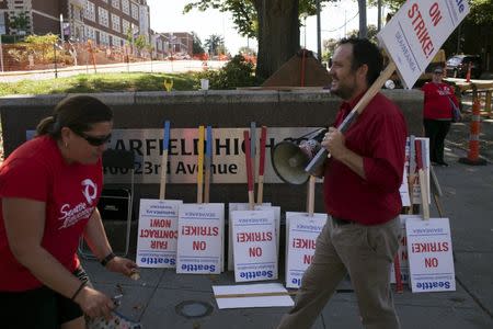 Teachers walk the picket line as they strike outside Garfield High School in Seattle, Washington September 9, 2015. REUTERS/Matt Mills McKnight