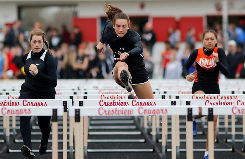South Central's Gracelyn Lamoreaux, Lucas' Shelby Grover and Ashland's Jasmine Duerson compete in the 100 meter hurdles during the Forest Pruner Track Invitational at Crestview High School on Friday, April 22, 2022. TOM E. PUSKAR/TIMES-GAZETTE.COM