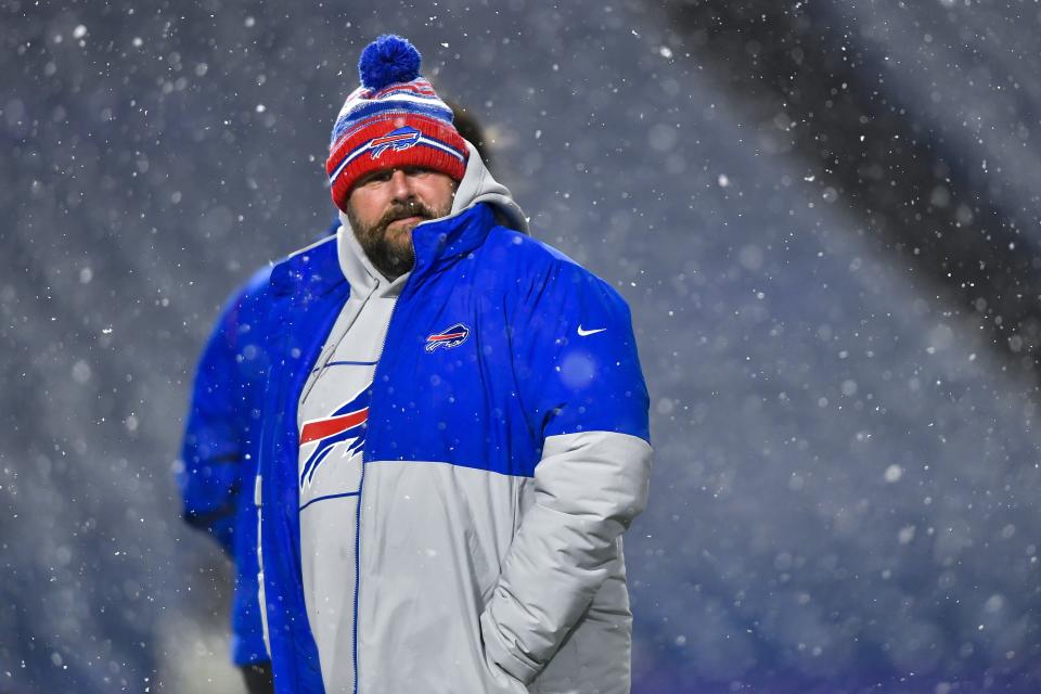 Buffalo Bills offensive coordinator Brian Daboll walks on the field before an NFL football game against the New England Patriots in Orchard Park, N.Y., Monday, Dec. 6, 2021. (AP Photo/Adrian Kraus)