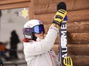 Kiana Kryeziu holds her skis prior to training at the Arxhena Ski center in Dragas, Kosovo on Saturday, Jan. 22, 2022. The 17-year-old Kryeziu is the first female athlete from Kosovo at the Olympic Winter Games after she met the required standards, with the last races held in Italy. (AP Photo/Visar Kryeziu)