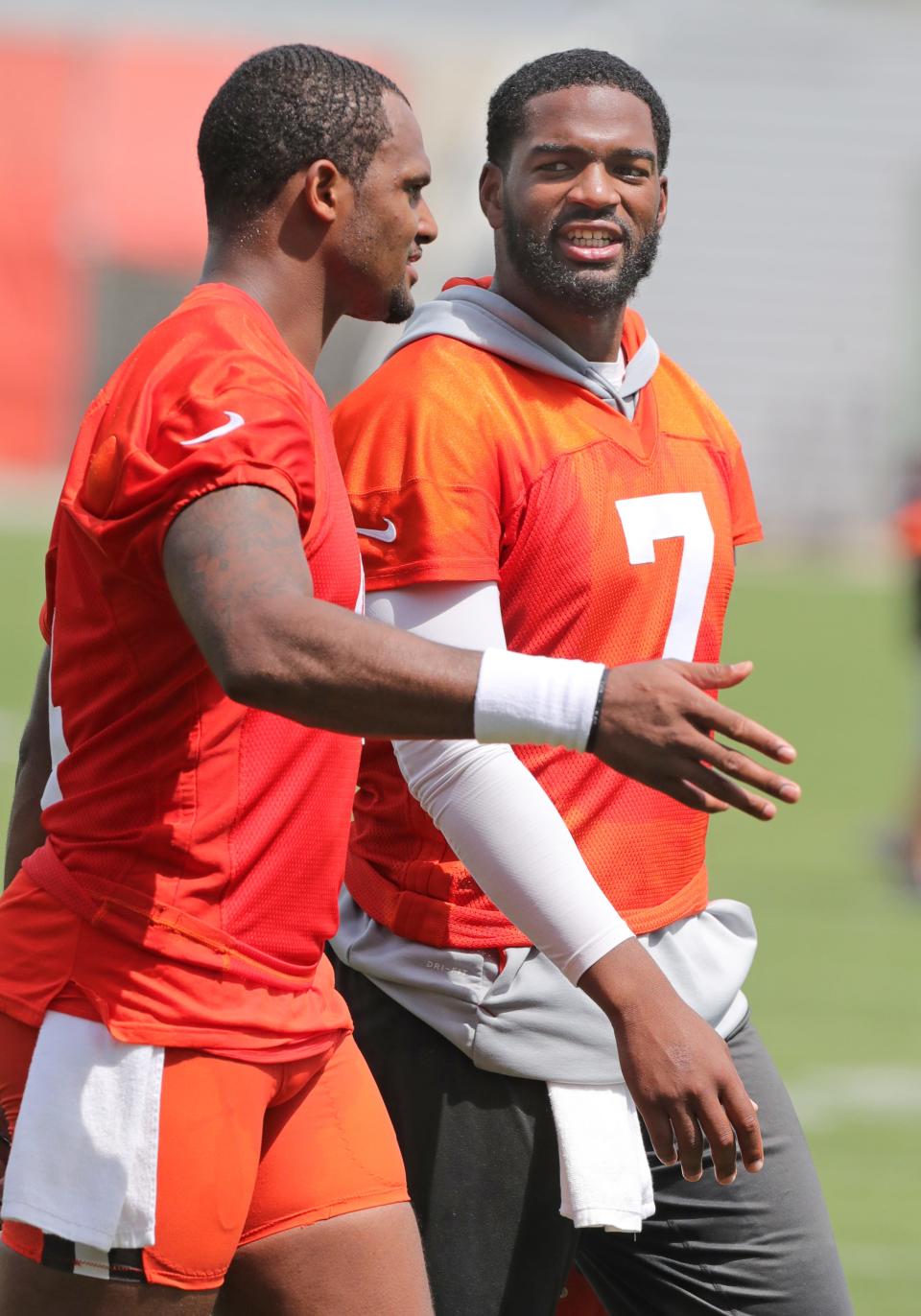 Cleveland Browns quarterbacks DeShawn Watson, left, and Jacoby Brissett head to 7 on 7 drills doing OTA workouts on Wednesday, June 1, 2022 in Berea.