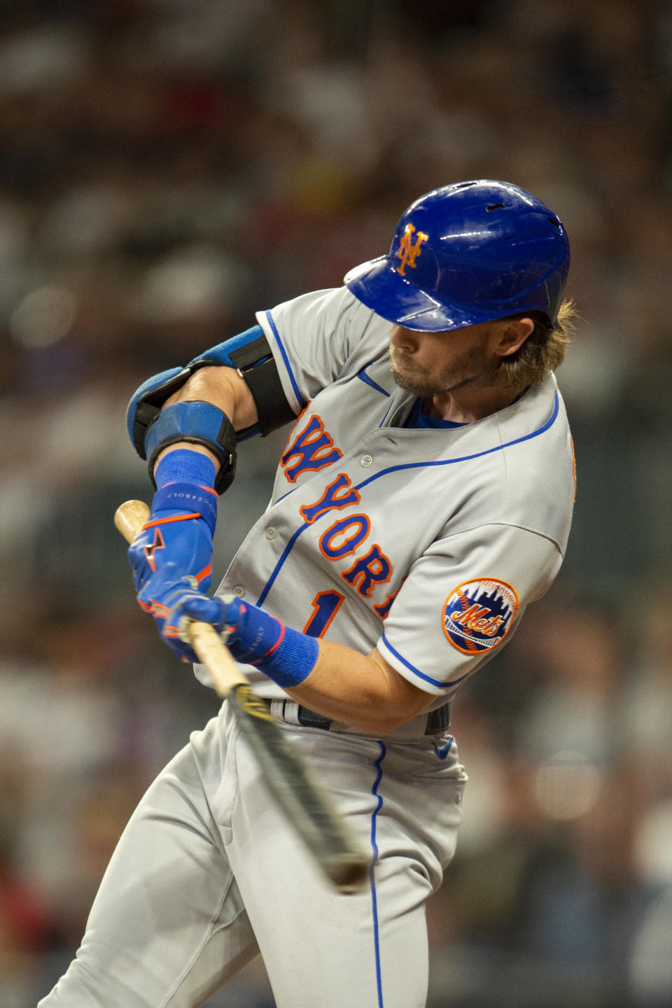 New York Mets second baseman Jeff McNeil hits a solo home run in the third inning of a baseball against the Atlanta Braves, Sunday, Oct. 2, 2022, in Atlanta. (AP Photo/Hakim Wright Sr.)