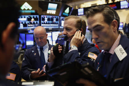 Traders work on the floor of the New York Stock Exchange (NYSE) shortly after the opening bell in New York, U.S., October 19, 2016. REUTERS/Lucas Jackson