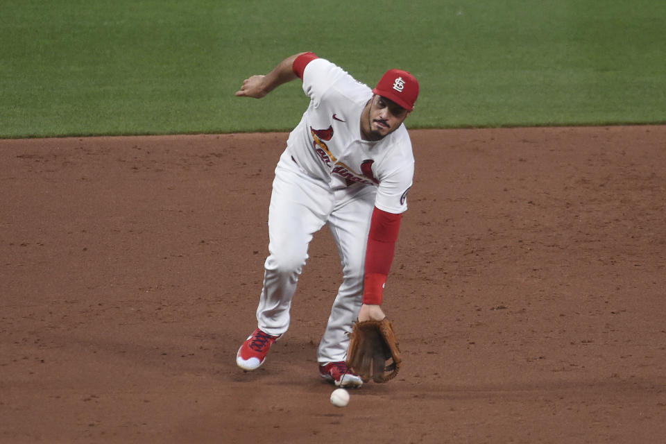 St. Louis Cardinals third baseman Nolan Arenado fields a ground ball by Pittsburgh Pirates' Jacob Stallings during the third inning of a baseball game Friday, June 25, 2021, in St. Louis. (AP Photo/Joe Puetz)