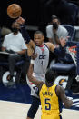 Washington Wizards' Russell Westbrook (4) makes a pass against Indiana Pacers' Edmond Sumner (5) during the first half of an NBA basketball game, Saturday, May 8, 2021, in Indianapolis. (AP Photo/Darron Cummings)