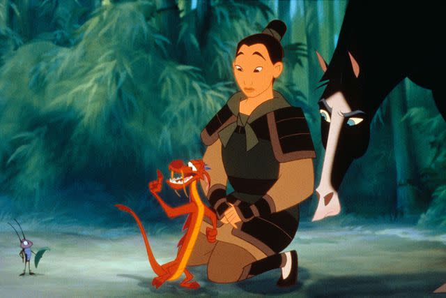 Walt Disney Pictures/Courtesy Everett Collection From left: Cri-kee, Mushu, Mulan, and Khan in 'Mulan'