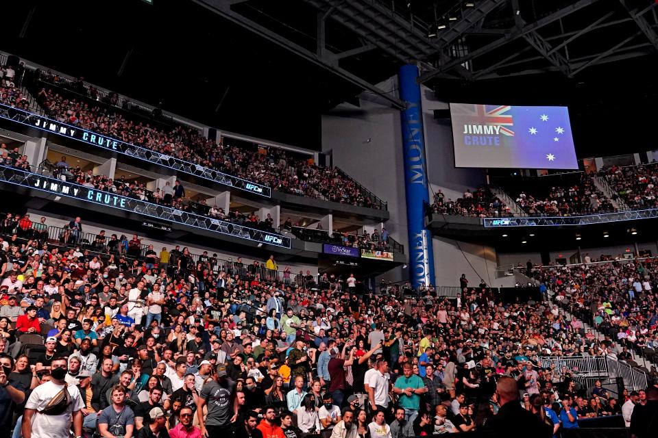 Fans fill the seats of VyStar Veterans Memorial Arena in Jacksonville during UFC 261.