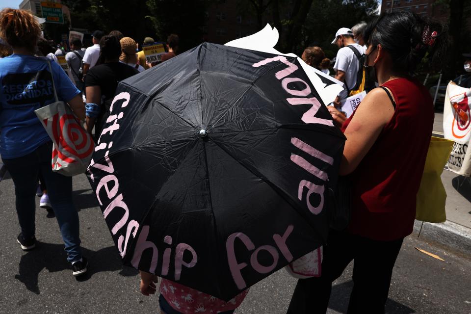 eople participate in a march in support of a pathway to citizenship for immigrants on July 23 in New York City. Various organizations, elected officials and immigrant essential works gathered for a national day of action demanding a pathway to citizenship to be included in the infrastructure package, after it was announced last week that congressional Democrats will include the provision.