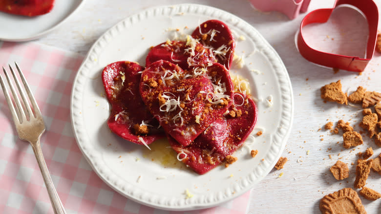 beet ravioli on white plate