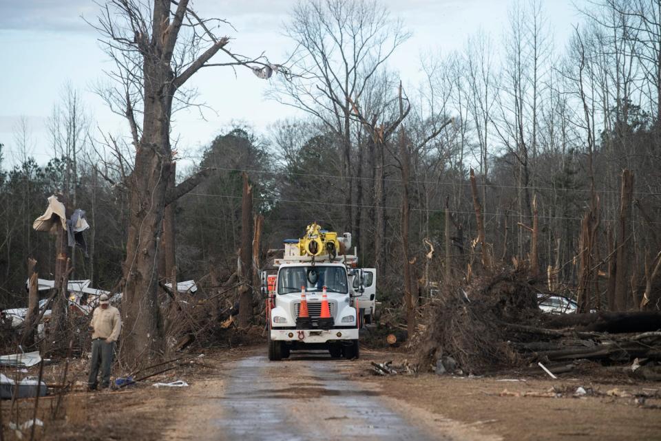 Power crews begin recovery on County Road 140 in Old Kingston, Alabama, on Thursday, Jan. 19, 2023. A tornado tore through Autauga County last Thursday, killing seven people.