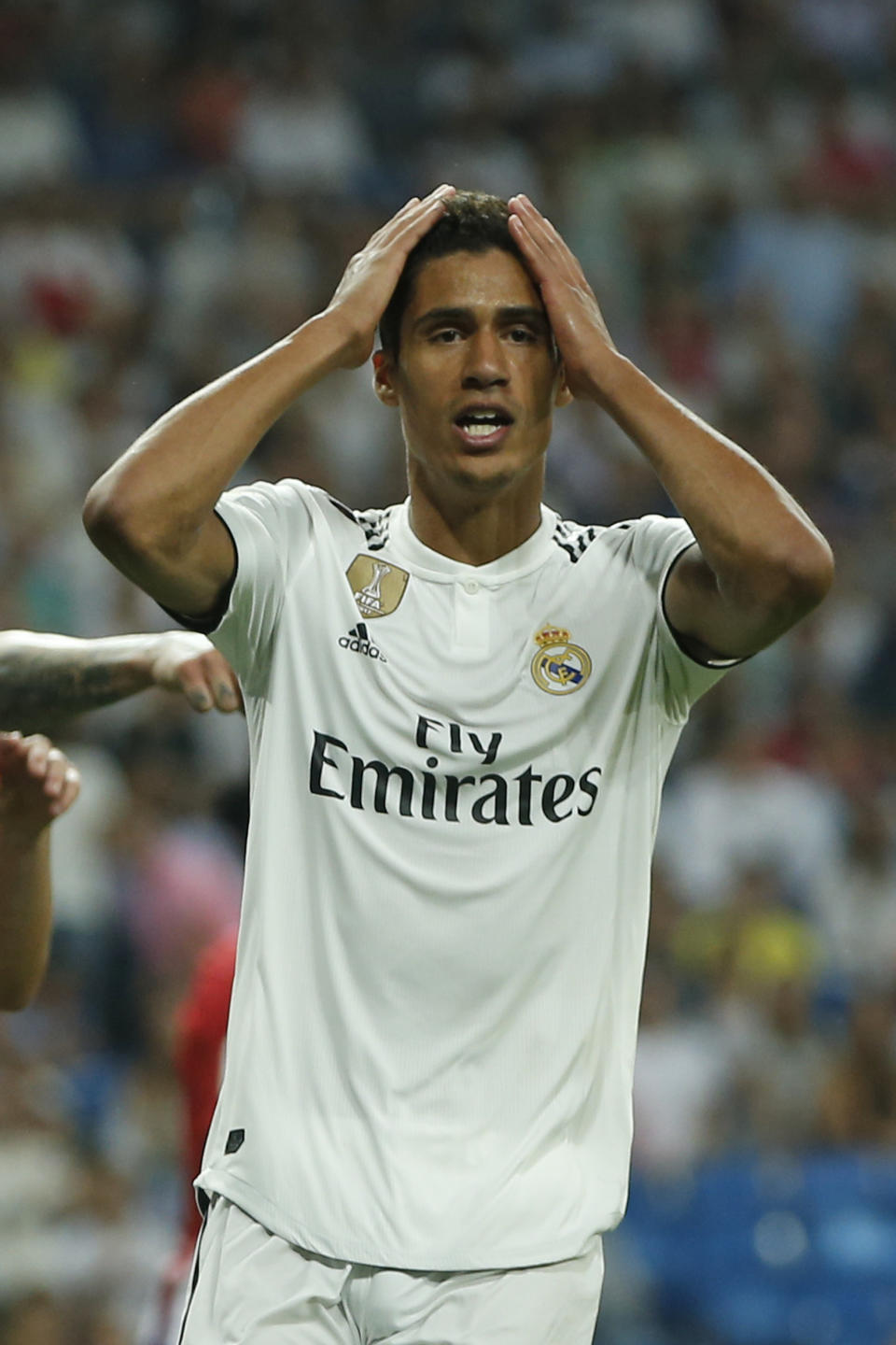 Real Madrid's Raphael Varane gestures after missing a chance during a Spanish La Liga soccer match between Real Madrid and Atletico Madrid at the Santiago Bernabeu stadium in Madrid, Spain, Saturday, Sept. 29, 2018. The match ended in a 0-0 draw. (AP Photo/Paul White)