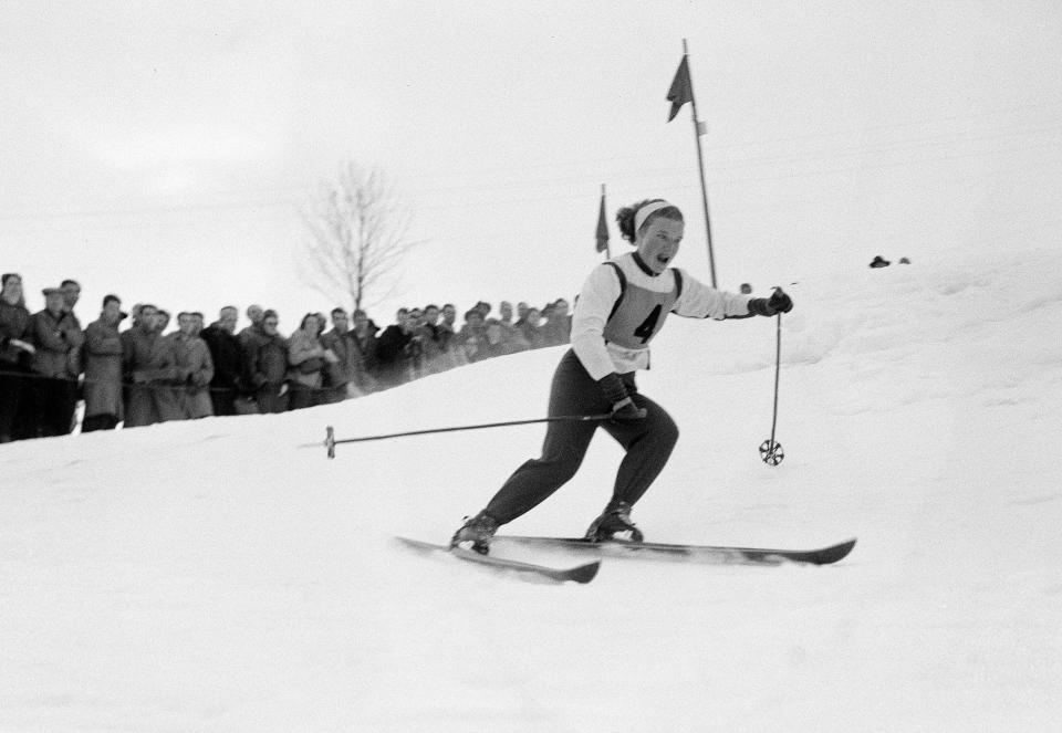 FILE - Canada's Lucile Wheeler speeds downhill during the Women's Slalom event at Kitzbuehel, Austria, Jan. 14, 1956, during a warm up meet for the VII Olympic Winter Games opening Jan. 26 at Cortina D'Ampezzo, Italy. Canadian Olympic ski racers Rhoda Wurtele Eaves, 102, and Wheeler, 89, have been friends for nearly 80 years. (AP Photo/File)