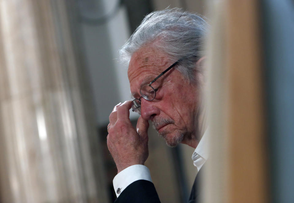 Austrian author Peter Handke attends a ceremony before receives the Order of the Karadjordje's Star from Serbian President Aleksandar Vucic in Belgrade, Serbia, Sunday, May 9, 2021. Serbia has decorated Austrian Nobel literature laureate Peter Handke, who is known for his apologist views over Serb war crimes during the 1990s' wars in the Balkans. (AP Photo/Darko Vojinovic)