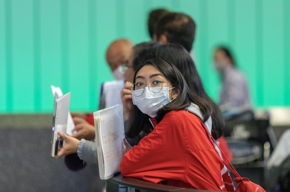 A woman waiting for an international traveler to arrive to LAX Tom Bradley International Terminal wears a medical mask for protection against the coronavirus outbreak on February 2, 2020 in Los Angeles, California. (Photo: David McNew/Getty Images)