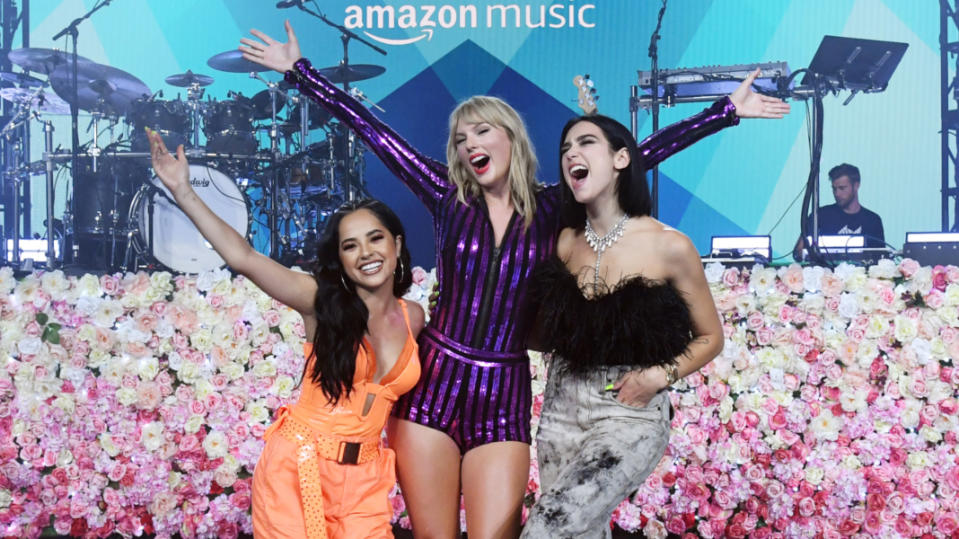 Becky G, Taylor Swift and Dua Lipa pose onstage at The Prime Day concert.