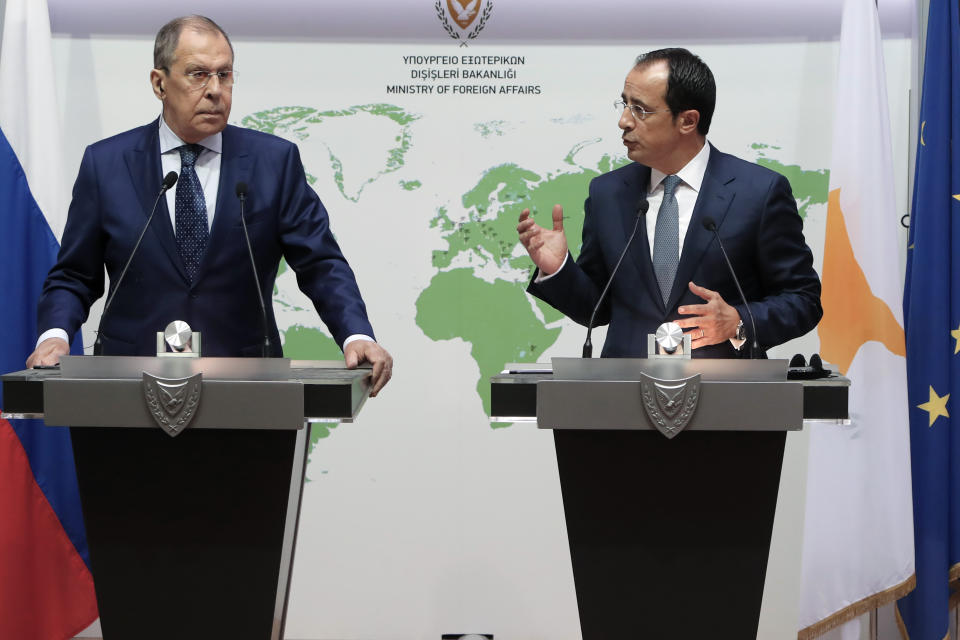 Russian Foreign Minister Sergey Lavrov, left, and his Cypriot counterpart Nikos Christodoulides talk to the media during a press conference at the foreign ministry house in Nicosia, Cyprus, Tuesday, Sept. 8, 2020. Lavrov is paying an official visit to Cyprus amid heightened tensions over Turkey's search for energy resources in east Mediterranean waters where Greece and Cyprus claim as having exclusive economic rights. (AP Photo/Petros Karadjias)