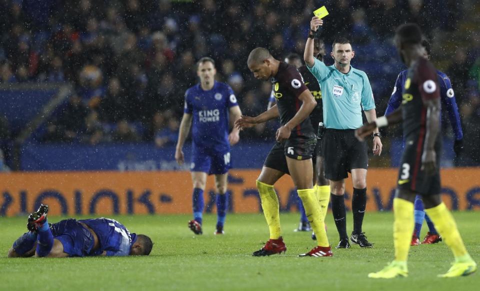 Football Soccer Britain - Leicester City v Manchester City - Premier League - King Power Stadium - 10/12/16 Manchester City's Fernando recieves a yellow card from referee Michael Oliver for a foul on Leicester City's Danny Simpson Action Images via Reuters / Carl Recine Livepic EDITORIAL USE ONLY. No use with unauthorized audio, video, data, fixture lists, club/league logos or "live" services. Online in-match use limited to 45 images, no video emulation. No use in betting, games or single club/league/player publications. Please contact your account representative for further details.